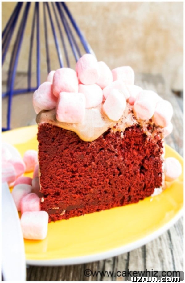 Slice of Easy Homemade Red Velvet Cake on Yellow Plate, showcasing its vibrant red color and moist texture