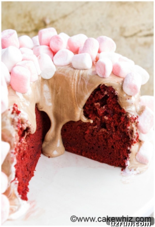 Best Red Velvet Cake From Scratch 3 Partially Sliced Best Red Velvet Cake With Icing Dripping, showing a generous layer of frosting