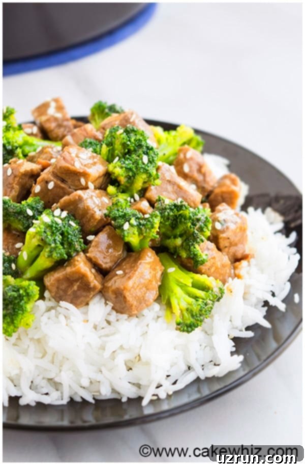 Effortless Slow Cooker Beef & Broccoli 4 Three serving bowls of slow cooker beef and broccoli with rice, showcasing different serving styles.