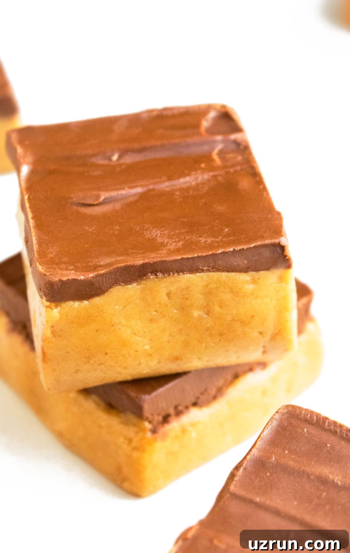 Stack of Easy No Bake Peanut Butter Bars on White Background. Healthy, homemade, and perfect for snacking.