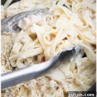 Effortless Slow Cooker Chicken Alfredo 6 Easy Creamy Chicken Alfredo in Black Slow Cooker.