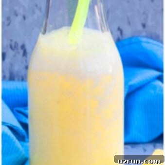 Simple Pineapple Smoothie Banana Free 4 Easy Tropical Pineapple Smoothie in Glass Bottle.