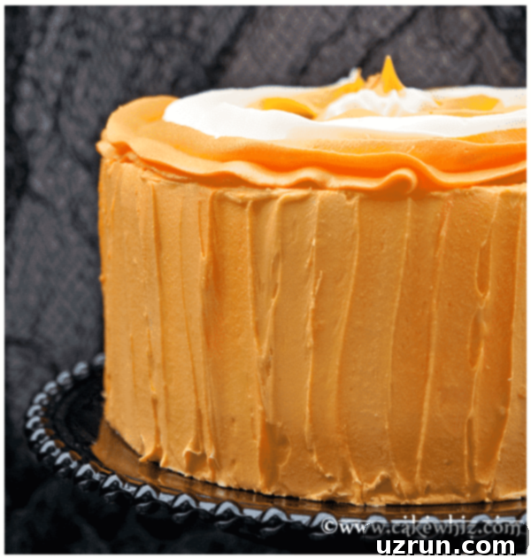 Simple Frosted Candy Corn Cake 4 Closeup Shot of Side of Cake Decorated With Spatula
