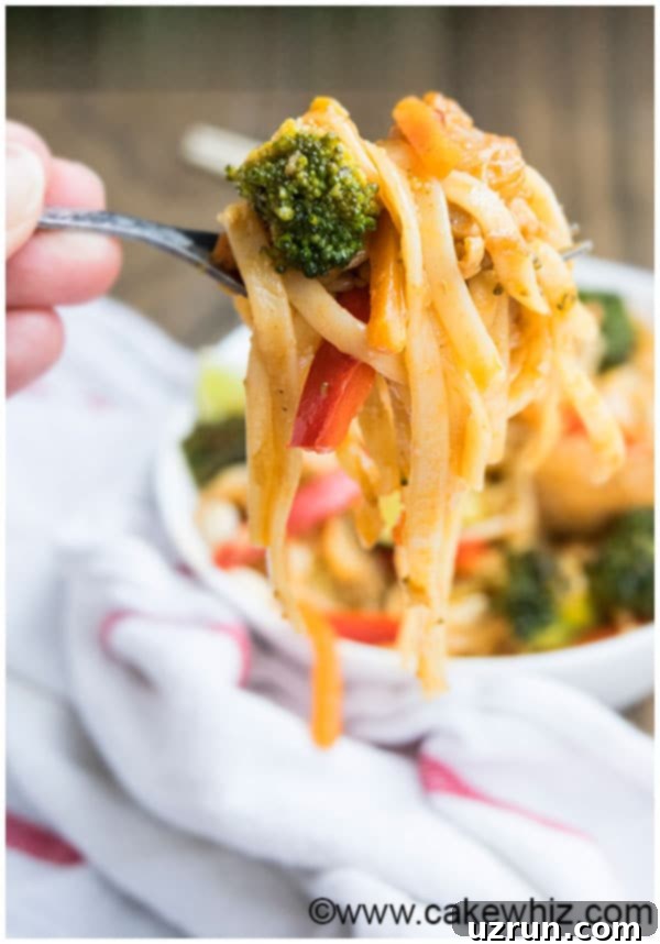 Chicken Pad Thai Recipe with colorful vegetables and peanuts.