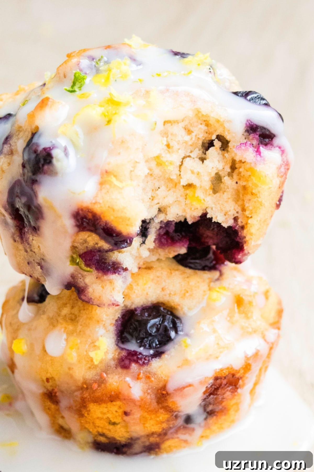 Glazed Lemon Blueberry Muffins 5 Partially Eaten Muffin- Closeup Shot.
