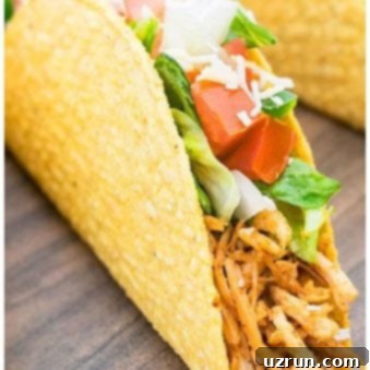 Savory Shredded Chicken Tacos 7 Easy Shredded Chicken Tacos on Wood Background.