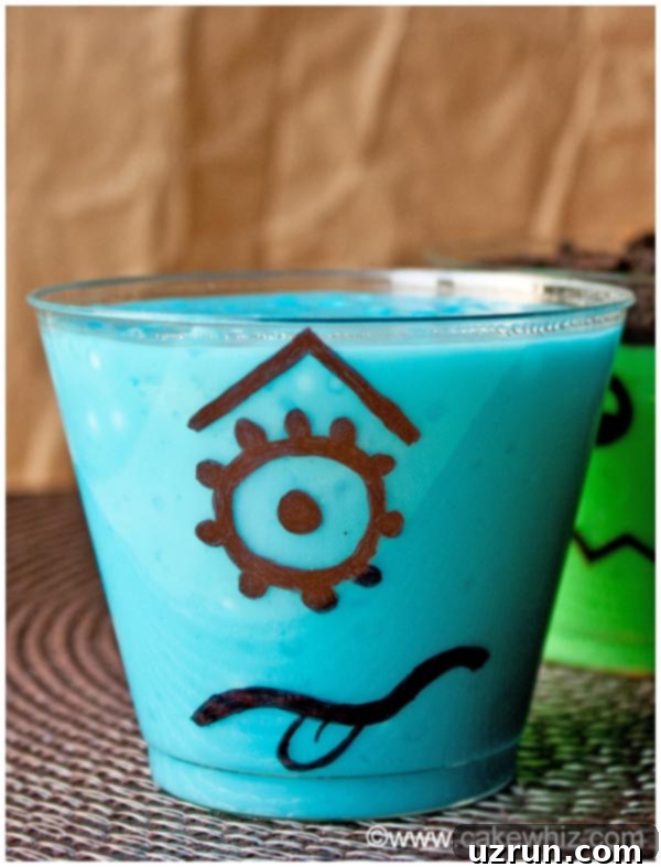 Fun Halloween Pudding Cups 4 Monster Pudding Cups on Brown Background