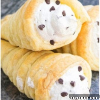 Effortless Cream Horn Delight 7 Stack of Best Easy Cream Horns With Puff Pastry on Rustic Gray Background.