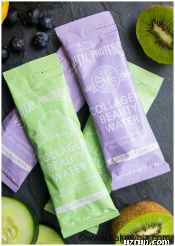 Vital Proteins Collagen Beauty Water packets in Lavender Lemon and Cucumber Aloe flavors, arranged with fresh ingredients