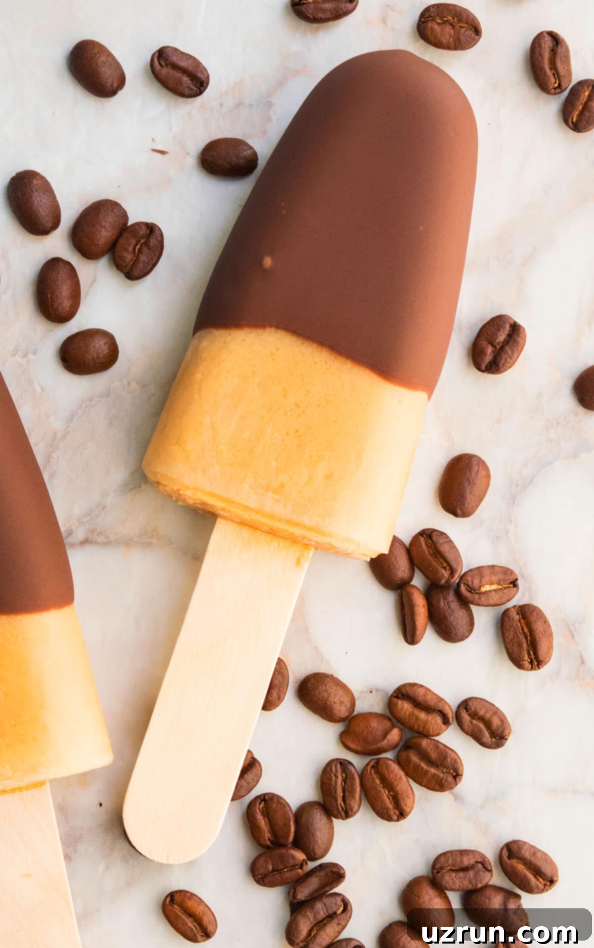 Easy Iced Coffee Popsicles on Marble Background With Coffee Beans. 
