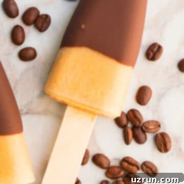 Iced Coffee Pops 7 Easy Iced Coffee Popsicles on Marble Background With Coffee Beans.