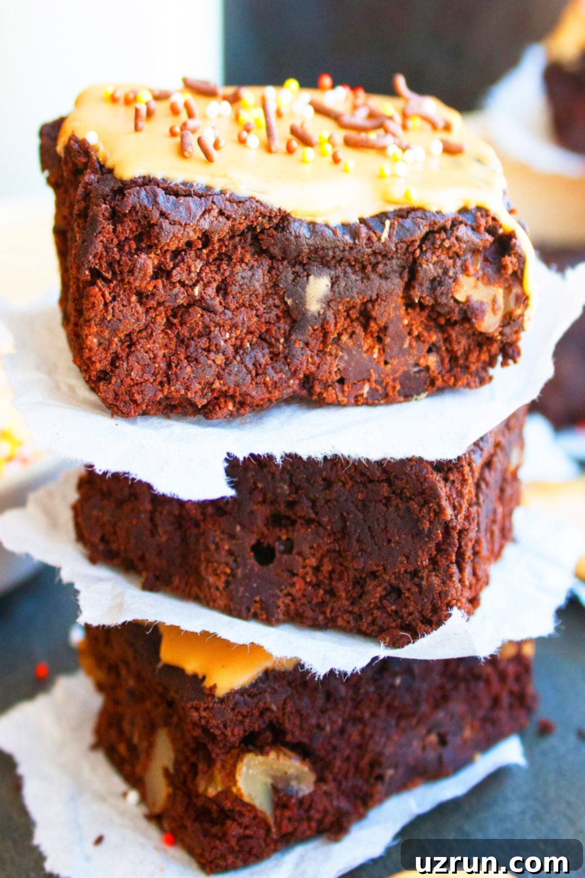 Stack of Easy Coffee Brownies With Espresso Glaze on Black Dish. 