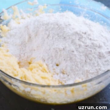 Perfectly Soft and Chewy Snickerdoodle Bars 7 Glass bowl with dry and wet mixture.