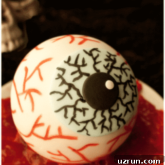 Spooky Easy Eyeball Cake Tutorial 5 Easy Spooky Halloween Eyeball Cake on White Plate With Red Jam