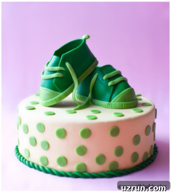 Easy Shoe Cake on Pink Background, decorated with fondant baby sneakers