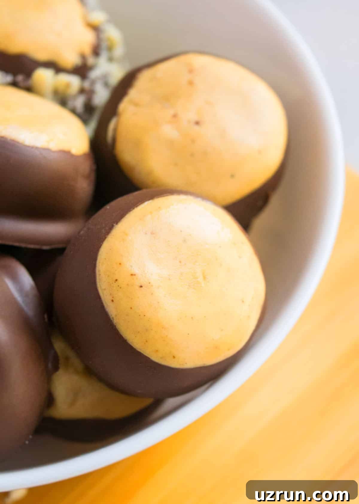 Easy Buckeyes Recipe (Chocolate Peanut Butter Balls) in White Bowl.