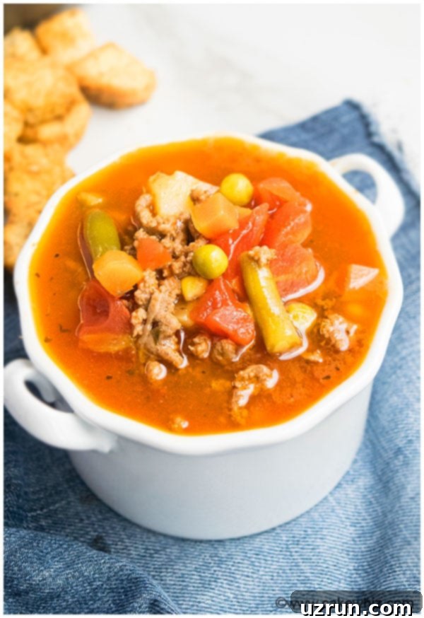 Homestyle Hamburger Soup 3 Hamburger Soup Recipe - Quick and Easy Dinner, served in a rustic bowl.