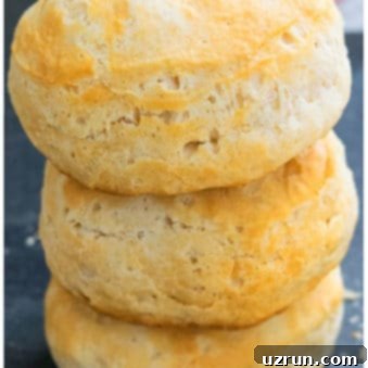 Effortless Fluffy Buttermilk Biscuits 5 Stack of Best Easy Homemade Buttermilk Biscuits on Dark Gray Background.