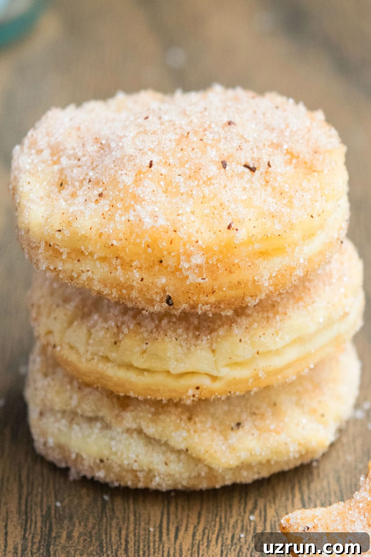 Stack of Easy Churro Cookies With Pie Crust on Rustic Wood Background