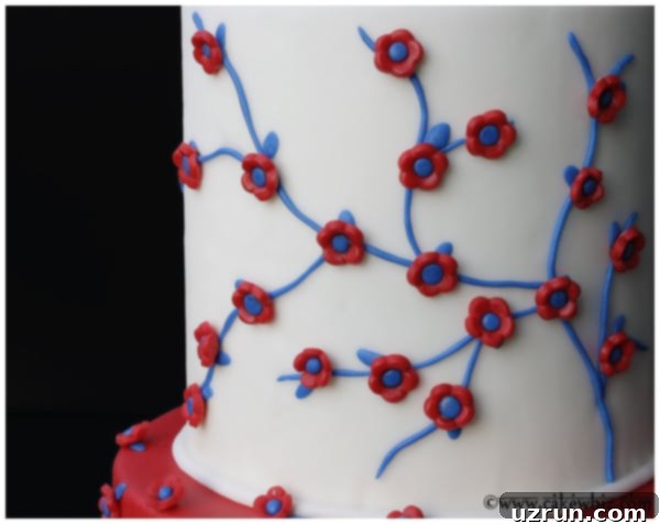 Easy Tiered 4th of July Cake 5 Easy Tiered Patriotic Cake With Red White and Blue Fondant Decorations on Black Background, ready for serving