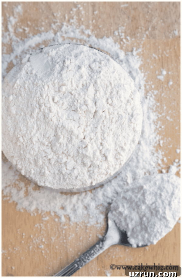 Make Your Own Cake Flour: The Simple Substitute 5 Best Baking Flour Blend in Measuring Cup, showing finely sifted flour