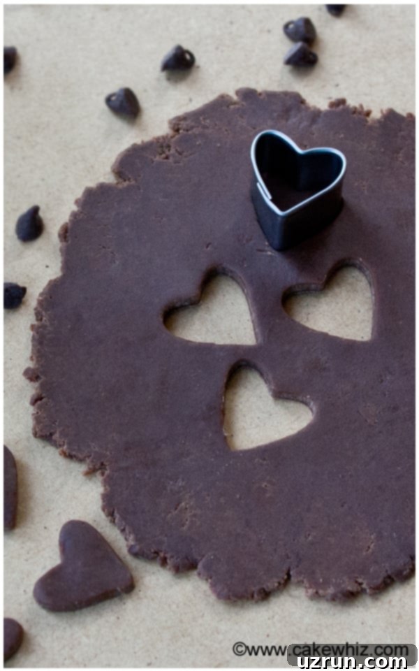 Easy Modeling Chocolate Rolled Out on Table With Heart Cut Outs 