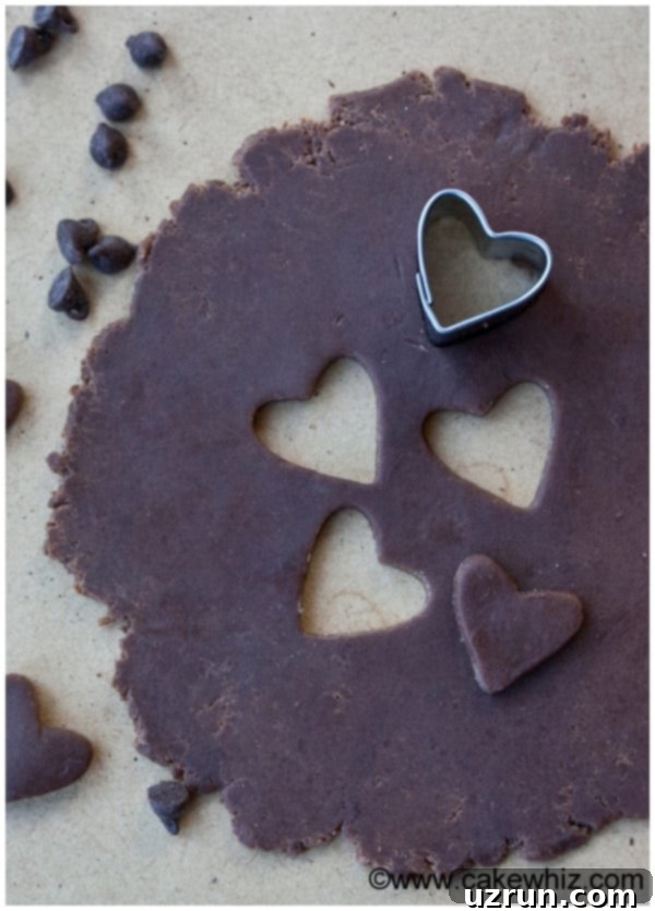 How to Make Modeling Chocolate 4 Edible Chocolate Clay Rolled Out on Table With Small Cookie Cutter