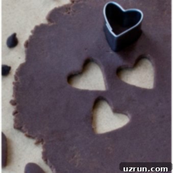 How to Make Modeling Chocolate 6 Easy Modeling Chocolate or Candy Clay Rolled Out on Table With Heart Cut Outs