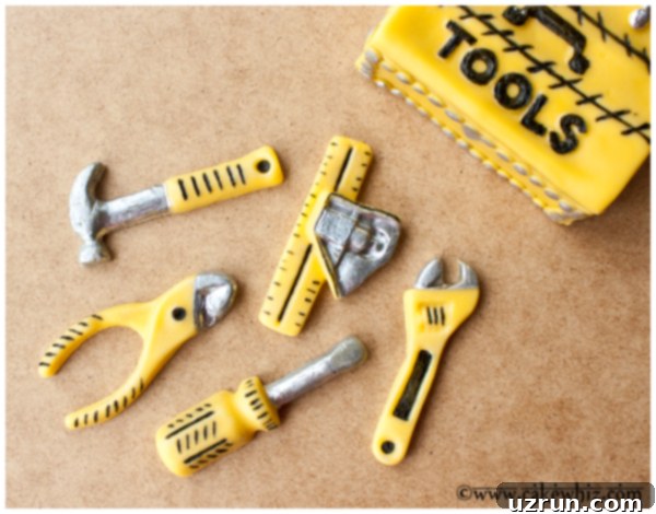 Father's Day Toolbox Cake 4 Closeup Shot of Gum Paste Tools on Brown Wood Background