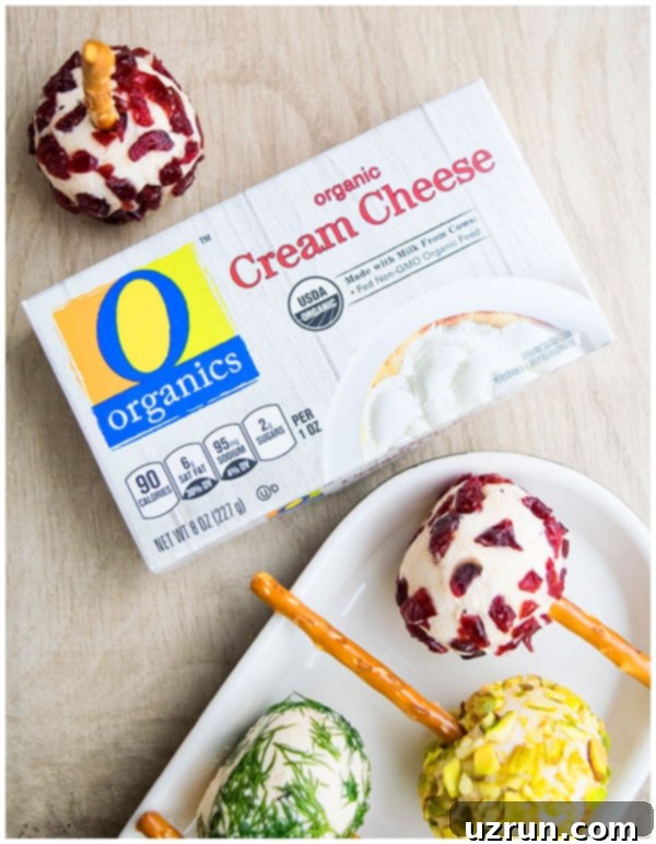 Box of O Organics Cream Cheese on Wood Background.