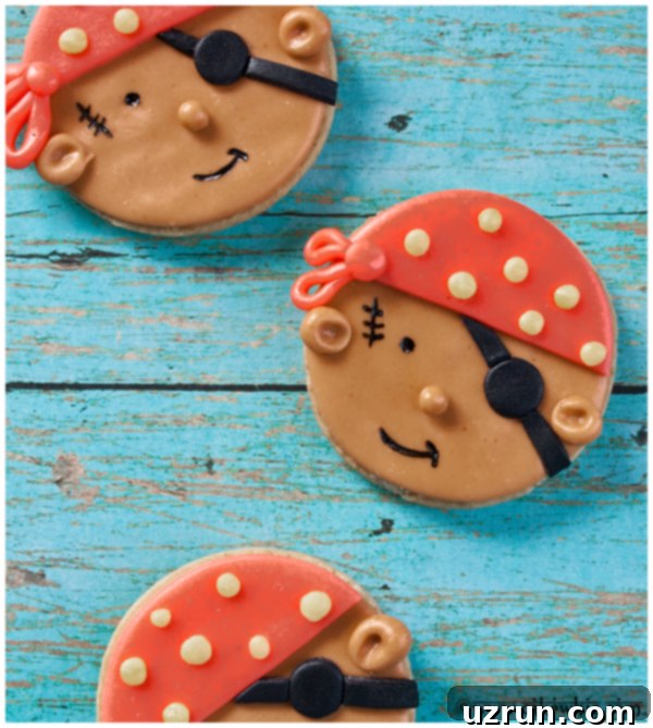 Easy Pirate Cookies Decorated With Fondant on Rustic Blue Background, ready for a birthday party.