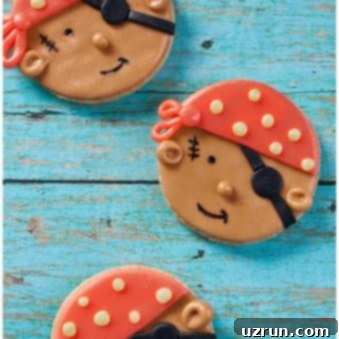 Swashbuckling Easy Fondant Cookies 5 Easy Pirate Cookies Decorated With Fondant on Rustic Blue Background.