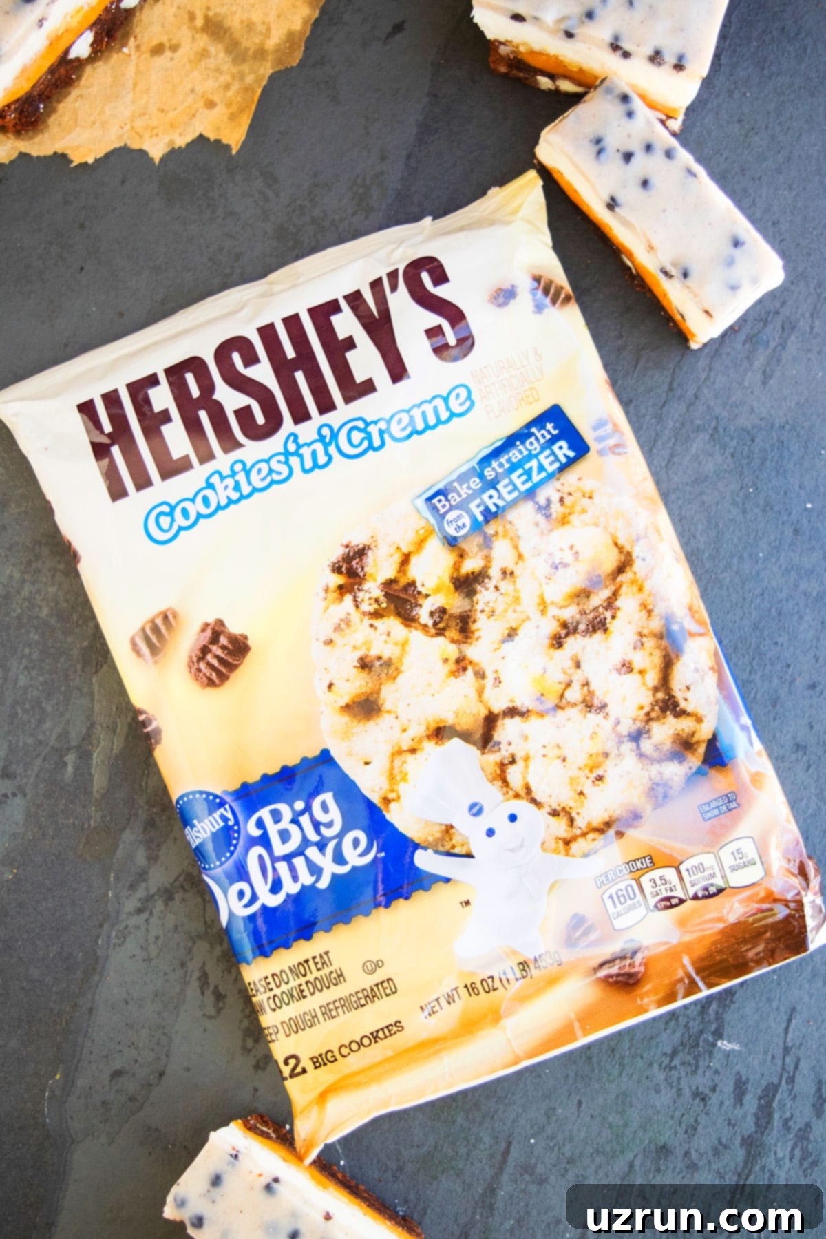 Five-Layer Chocolate Cookie Bars 12 Pillsbury Hersheys Cookies N Creme Cookie Dough on Black Stone Background.