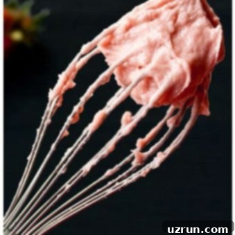 Luscious Fresh Strawberry Frosting 5 Easy Strawberry Frosting With Fresh Strawberries on Whisk With Black Background