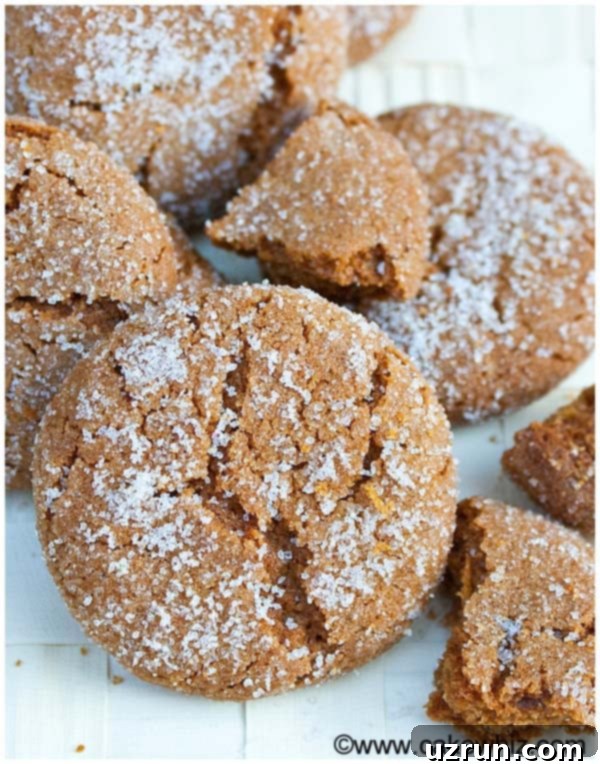 Easy Molasses Cookies Pile on Textured Beige Background