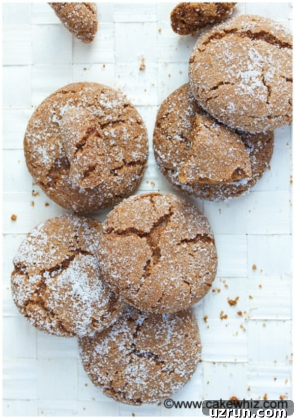Soft and Chewy Molasses Cookies 4 Easy Homemade Molasses Crinkles on Textured Beige Background