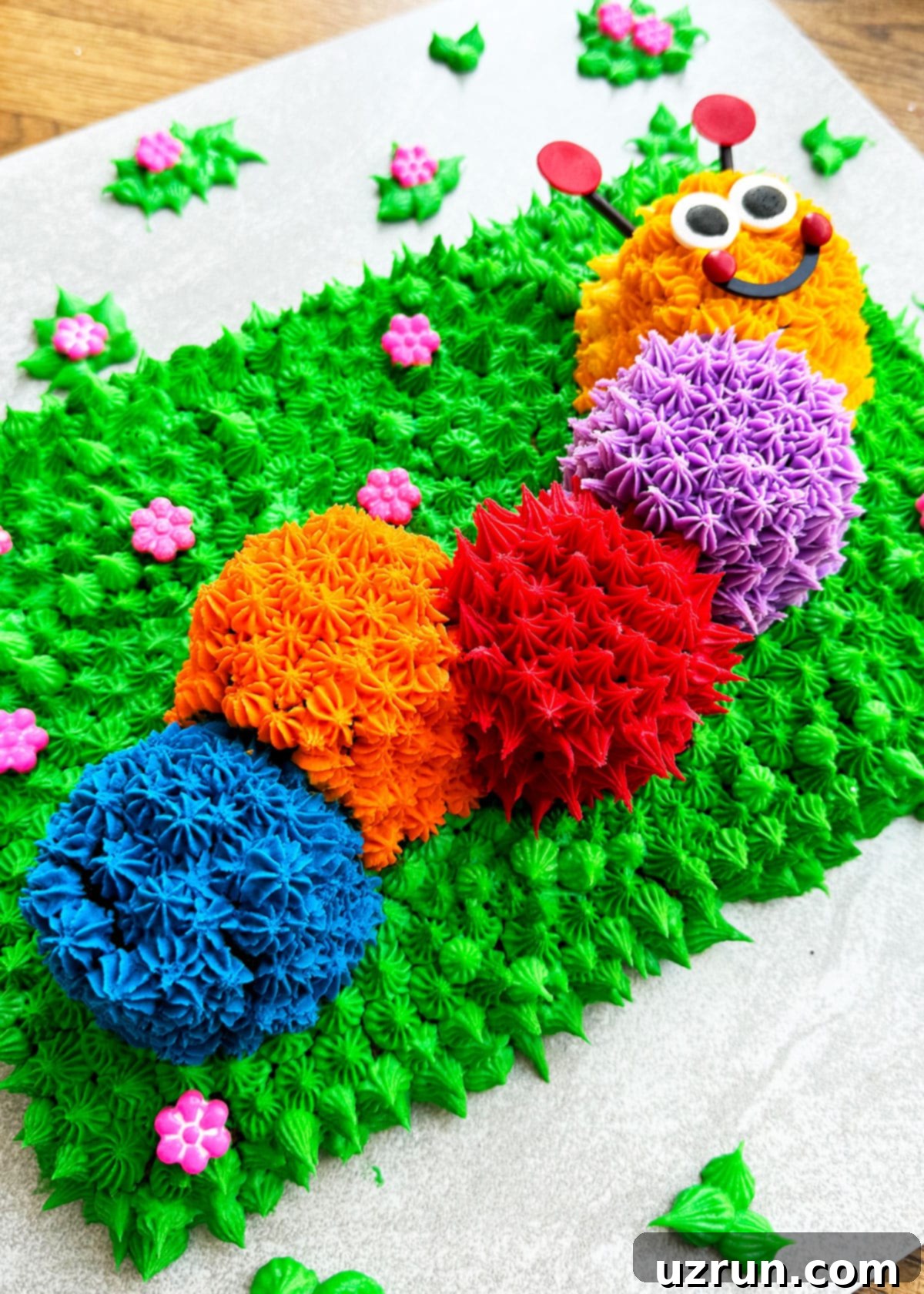 Decorated Birthday Cake on Light Gray Cake Board. 