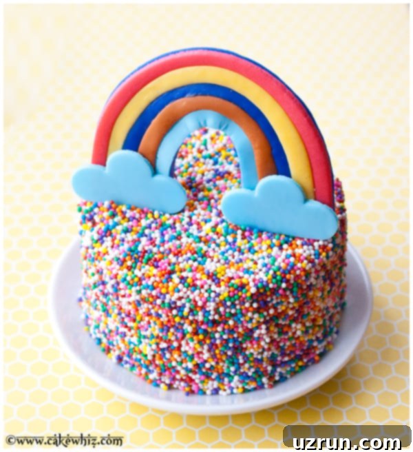 Easy Rainbow Sprinkle Cake on White Plate with Yellow Background