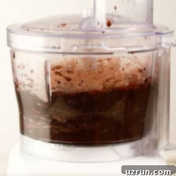 Delightfully Simple Gluten Free Black Bean Brownies 5 Blender with brownie batter being mixed until smooth.