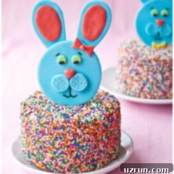 Whimsical Easter Cake Bunny 5 Easy Easter Fondant Bunny Cake Topper on Sprinkle Cake Placed on White Plate.