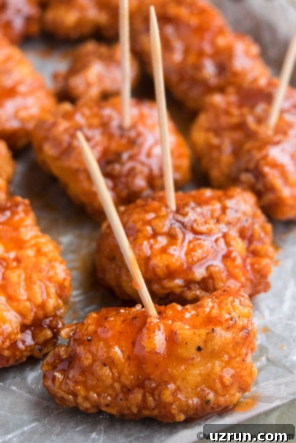 Honey Sriracha Chicken Bites on Sheet of Wax Paper. 