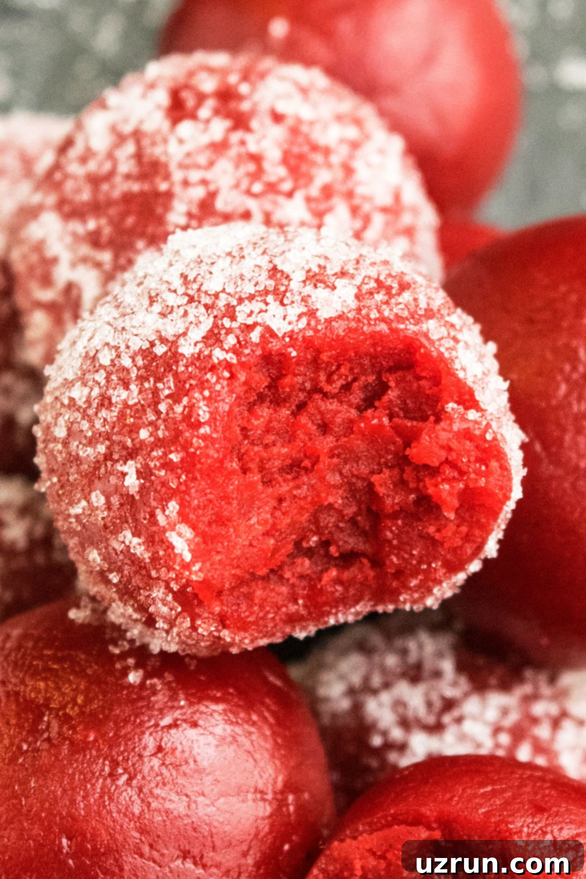 Cake Mix Red Velvet Truffles 3 Partially Eaten Red Cake Ball- Closeup Shot.