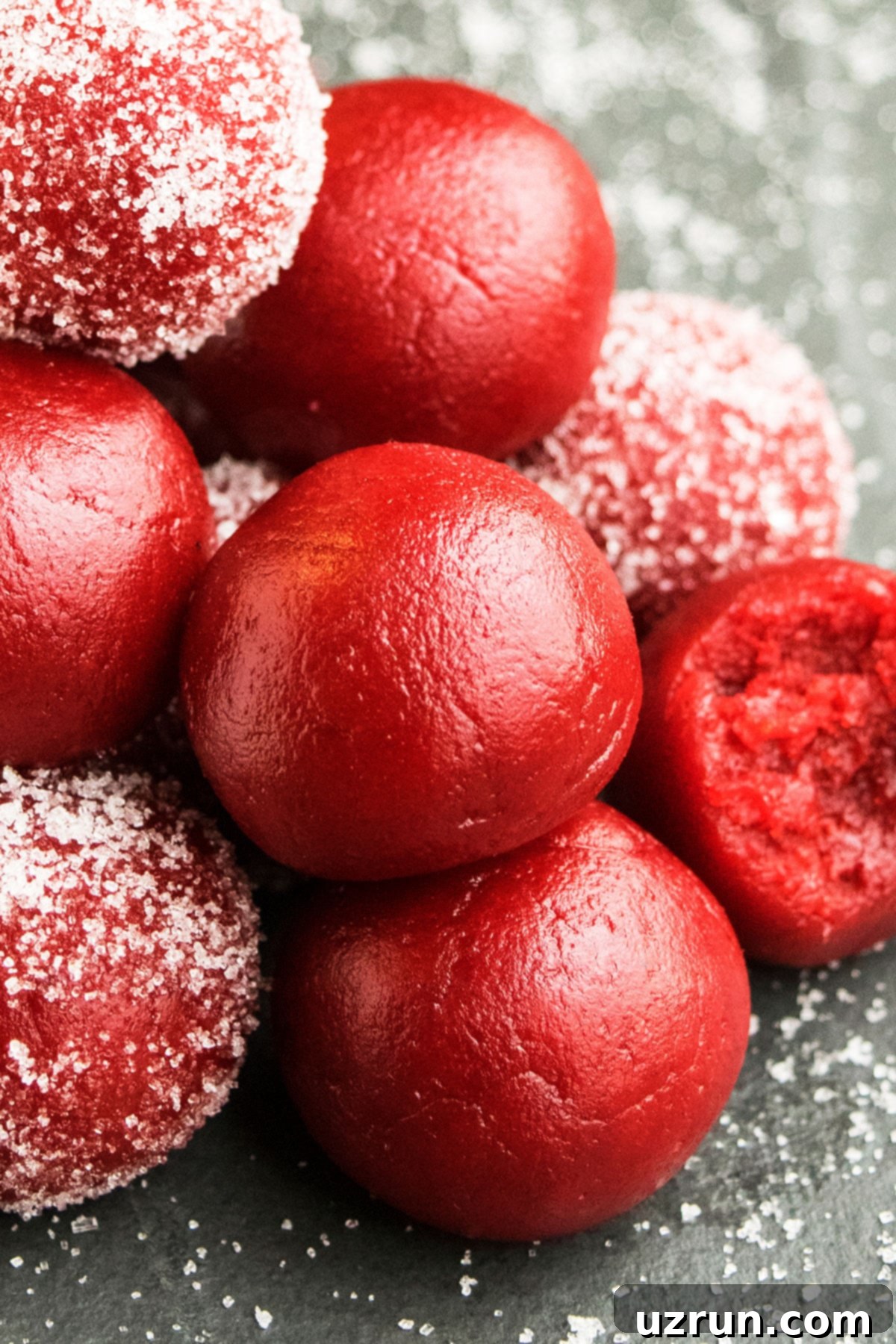 Cake Mix Red Velvet Truffles 4 Valentine's Day Red Cake Truffles Stacked on Rustic Gray Background.