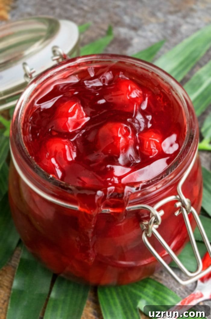 Easy Homemade Cherry Pie Filling Fresh or Frozen 3 Homemade Cherry Filling in Glass Jar on Green Leaf