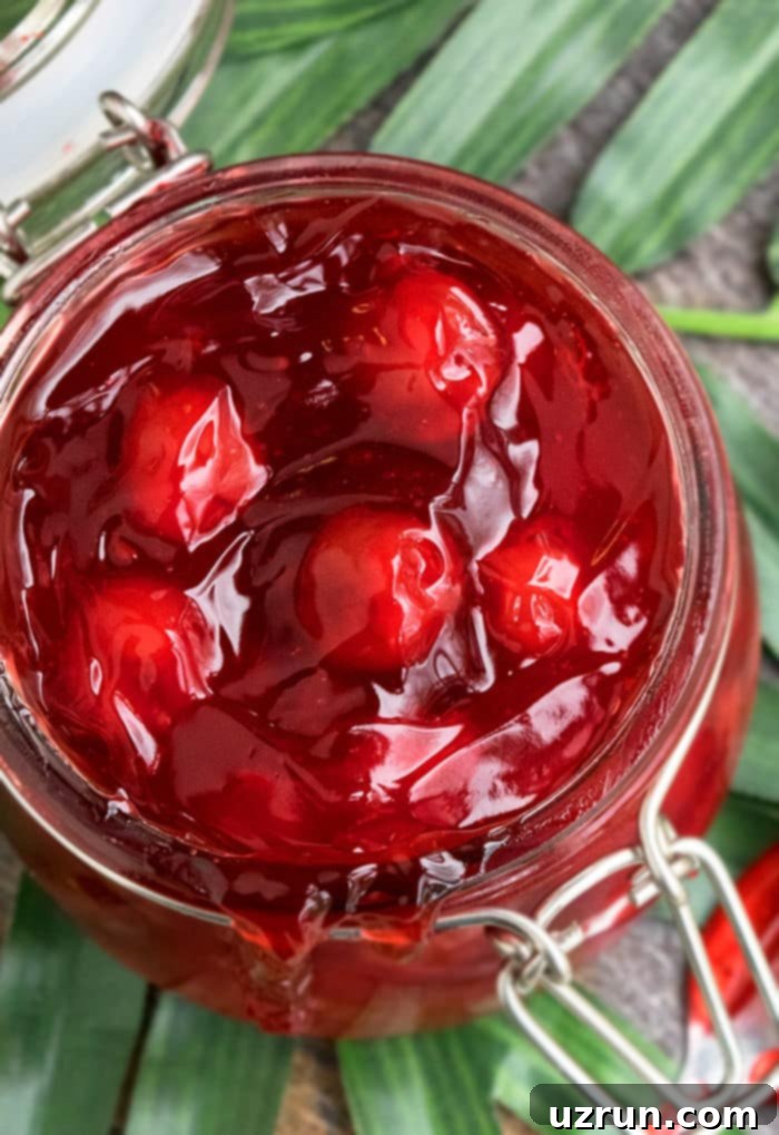 Easy Homemade Cherry Pie Filling Fresh or Frozen 4 Closeup Shot of Red Pie Filling in Glass Jar