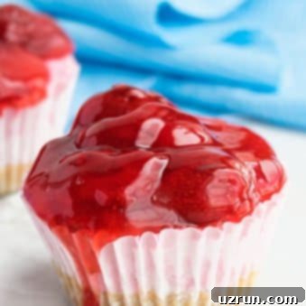 Mini Strawberry Cheesecake Cupcakes 6 Easy No Bake Mini Strawberry Cheesecake Cupcakes on White Marble Background.