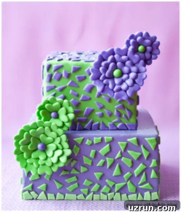 Square Tiered Cake With Edible Easy Fondant Flowers on Pink Background