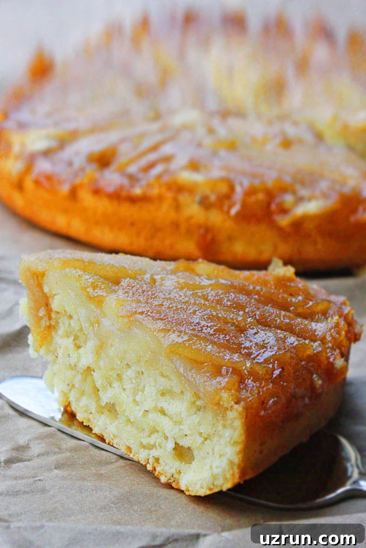 Golden Caramelized Pear Upside Down Cake 5 Slice of Cake on Silver Spatula- Closeup Shot