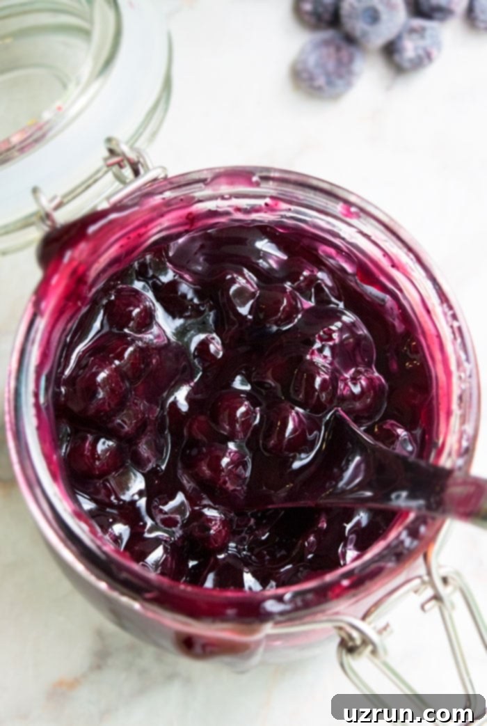 Best Homemade Pie Filling in Glass Jar on White Marble Background. 