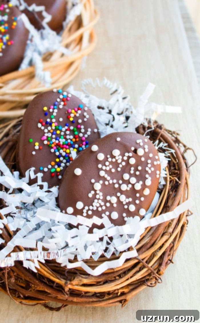 Easy 4-Ingredient Peanut Butter Eggs 4 Homemade Decorated Easter Candy on Fake Nest.
